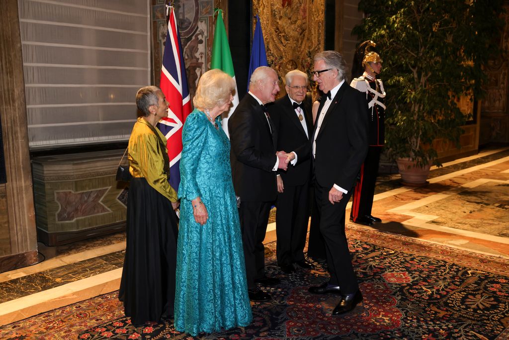 ROME, ITALY - APRIL 9: King Charles III And Queen Camilla greets guests as they arrive at a State Banquet at Quirinale Palace while they stand with President of Italy Sergio Mattarella and his wife Marisa Chiazzese during day three of King Charles III and Queen Camilla's State visit to The Republic of Italy on April 9, 2025 in Rome, Italy. (Photo by Andrew Parsons - Pool/Getty Images)