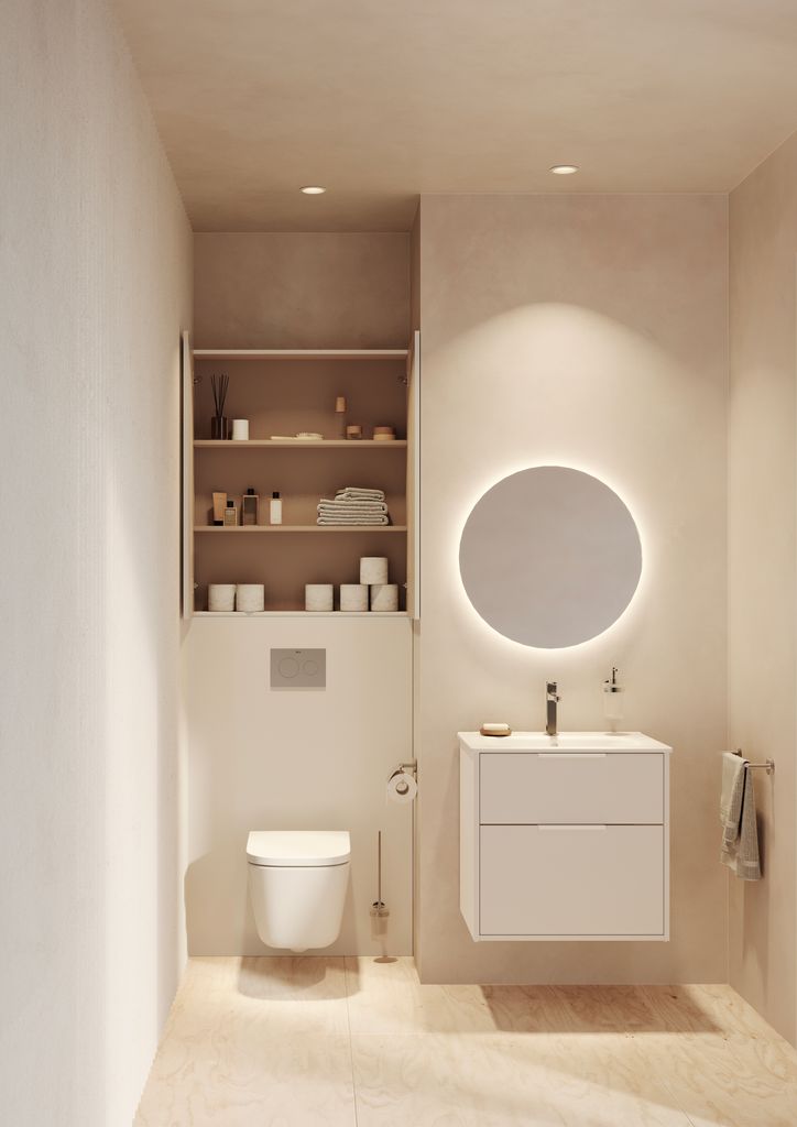 Baño blanco con inodoro suspendido y mueble de Roca