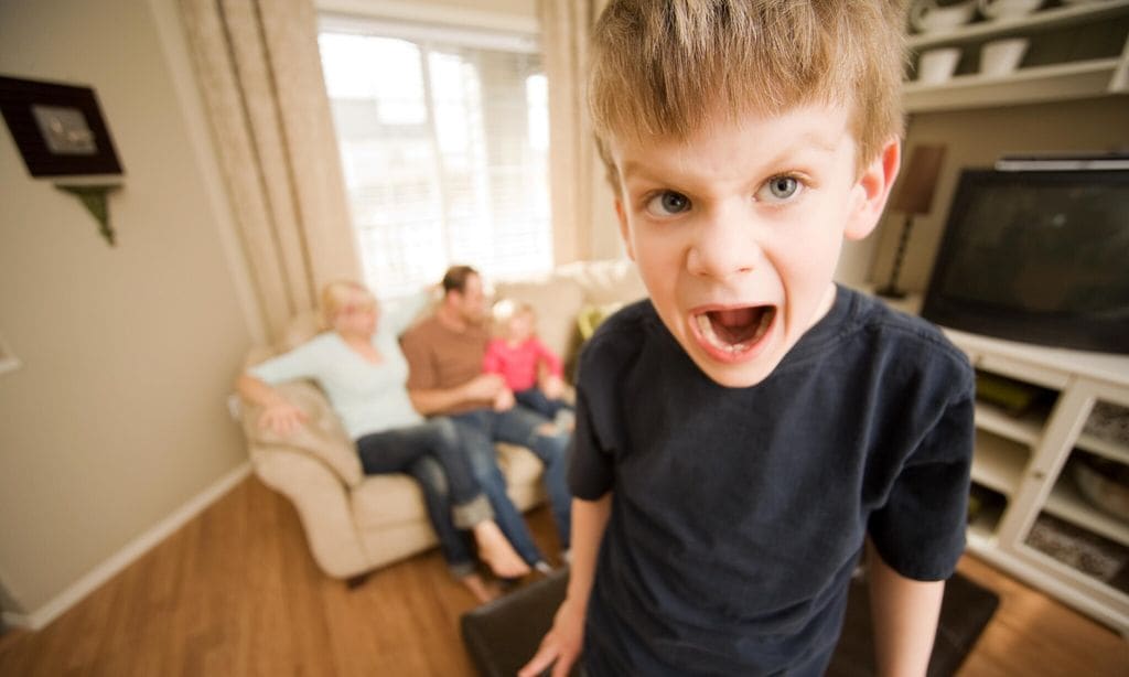 Spoiled child screaming at living room