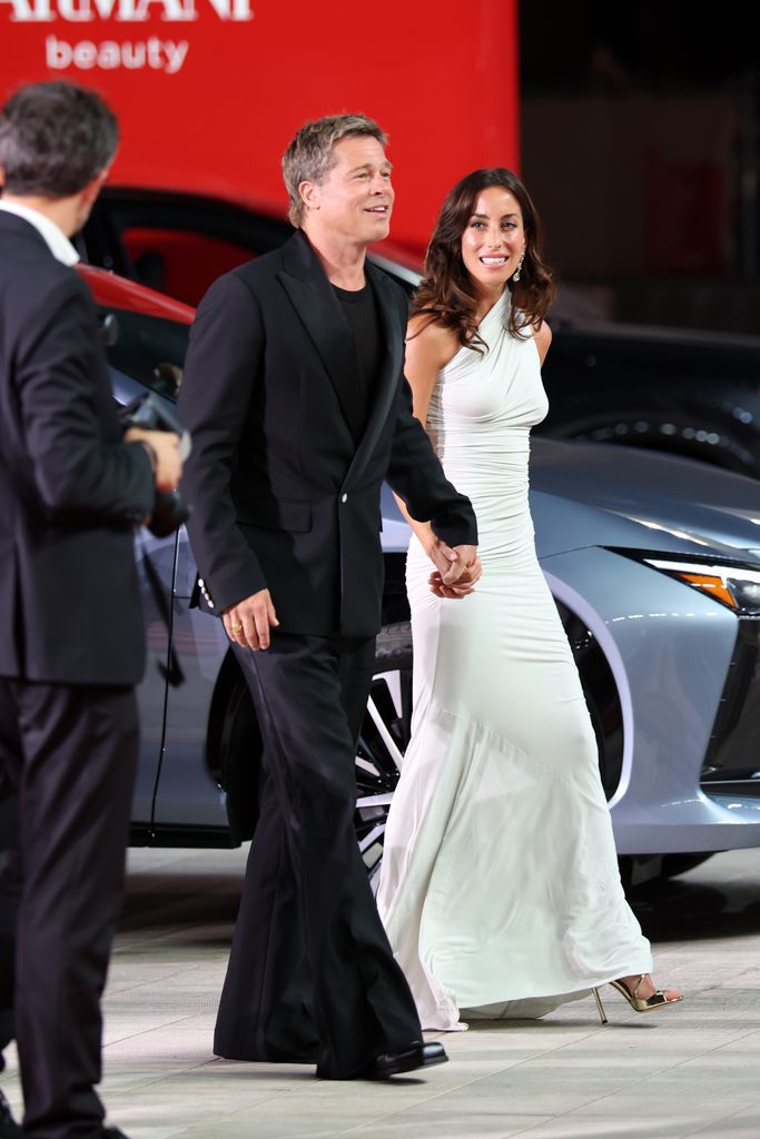 VENICE, ITALY - SEPTEMBER 01: Brad Pitt and Ines de Ramon attend the "Wolfs" red carpet during the 81st Venice International Film Festival on September 01, 2024 in Venice, Italy. (Photo by Daniele Venturelli/WireImage)