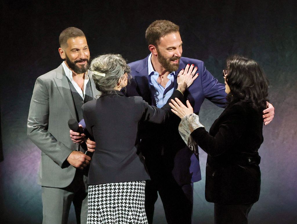 Jon Bernthal (l) and ben afflect (3rd l) are introduced onstage by Amazon Mgm Studios Head of Film Courtenay Valenti (2nd L) and Amazon Mgm Studios Head of Marketing Sue Kroll (R) At The Amazon Mgm Studios Presentation During Cinemacon, The Official Convention of Cinema Unite The Colosseum At Caesars Palace On April 02, 2025 in Las Vegas, Nevada