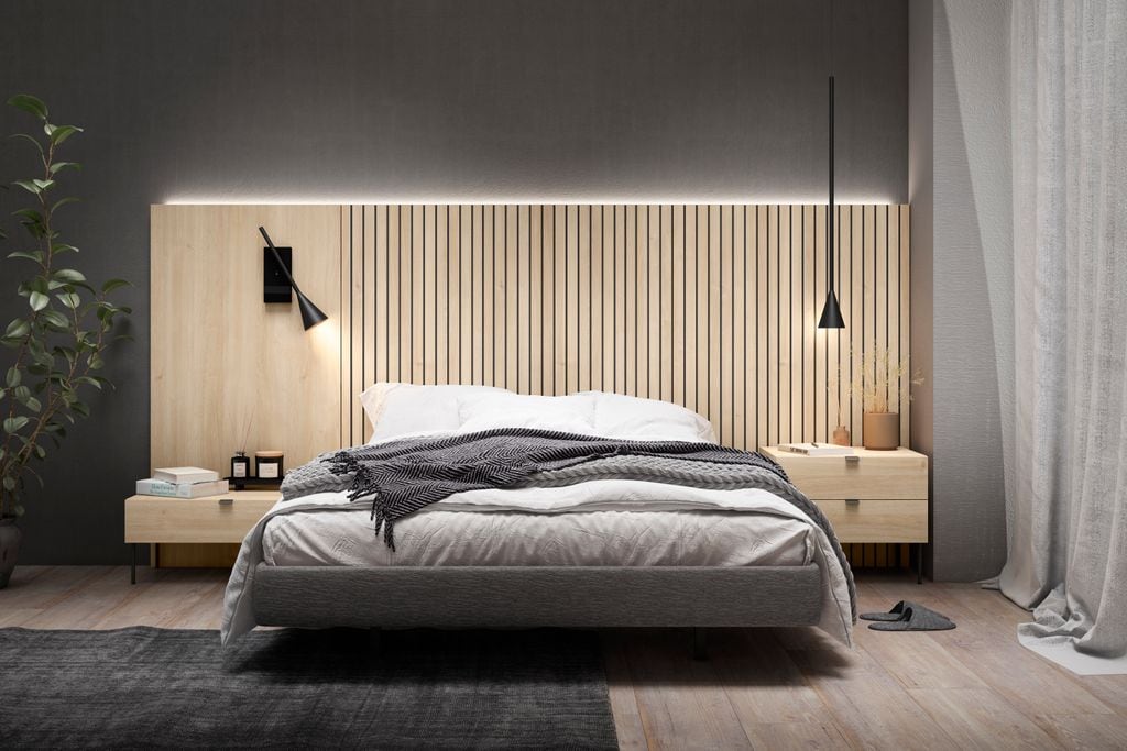 Dormitorio con cabecero con iluminación envolvente