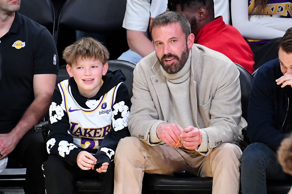 LOS ANGELES, CALIFORNIA - FEBRUARY 06: Ben Affleck and Samuel Garner Affleck attend a basketball game between the Los Angeles Lakers and the Golden State Warriors at Crypto.com Arena on February 06, 2025 in Los Angeles, California. NOTE TO USER: User expressly acknowledges and agrees that, by downloading and or using this photograph, User is consenting to the terms and conditions of the Getty Images License Agreement. (Photo by Allen Berezovsky/Getty Images)