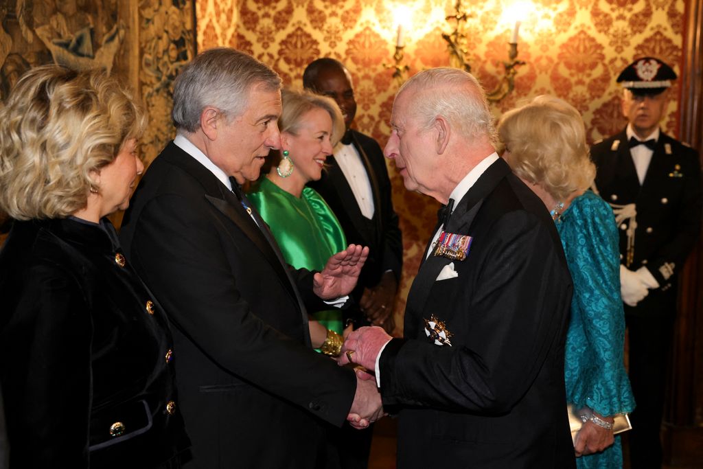 Italy's Deputy Prime Minister and Foreign Minister, Antonio Tajani (L) shakes hands with Britain's King Charles III at the Quirinale Presidential Palace before a state banquet, on April 9, 2025.  (Photo by Andrew PARSONS / POOL / AFP) (Photo by ANDREW PARSONS/POOL/AFP via Getty Images)          