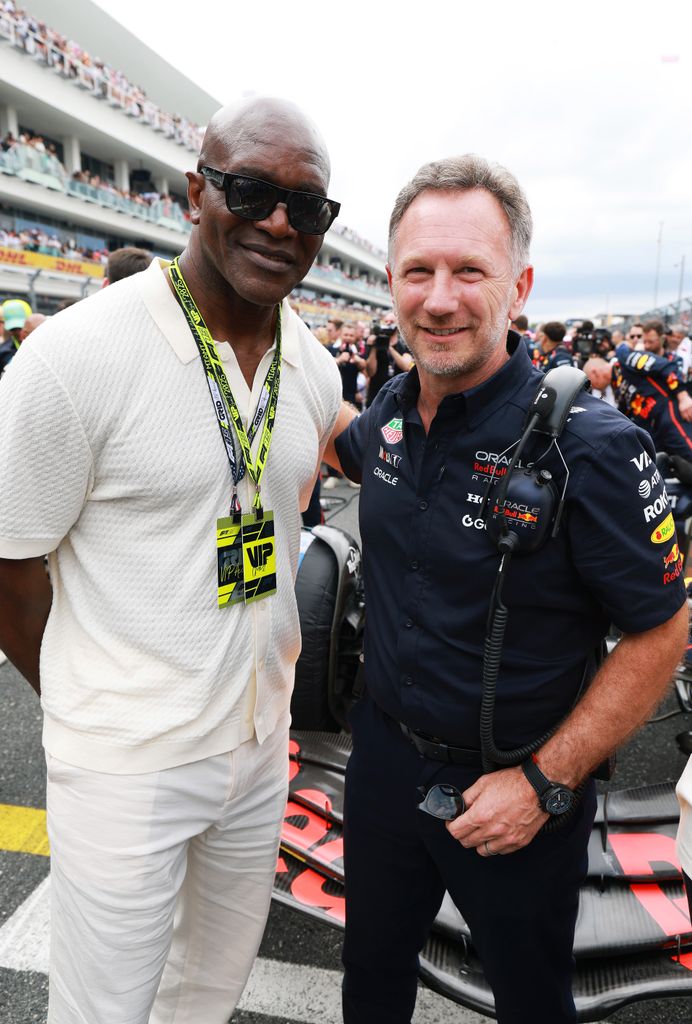 El excampeón mundial de boxeo Evander Holyfield junto a Christian Horner, director del equipo Red Bull Racing y marido de la ex Spice Girl Geri Halliwell