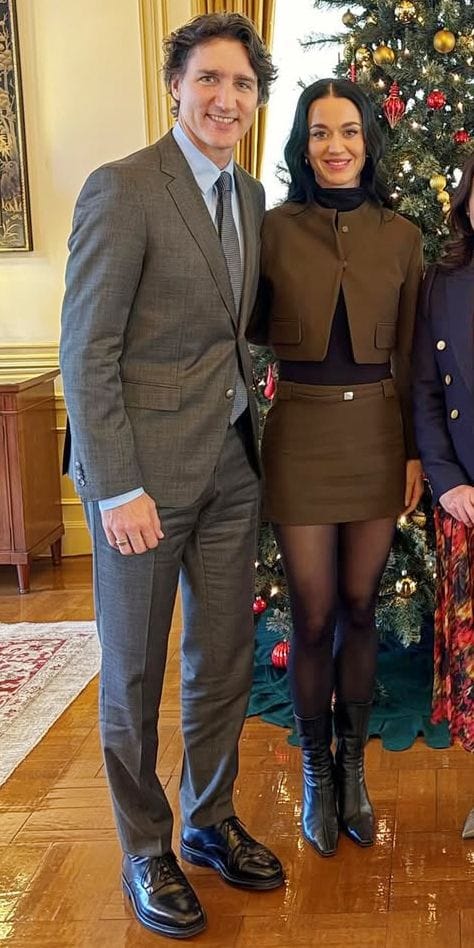 Katy Perry y Justin Trudeau posan con el primer ministro de Japón