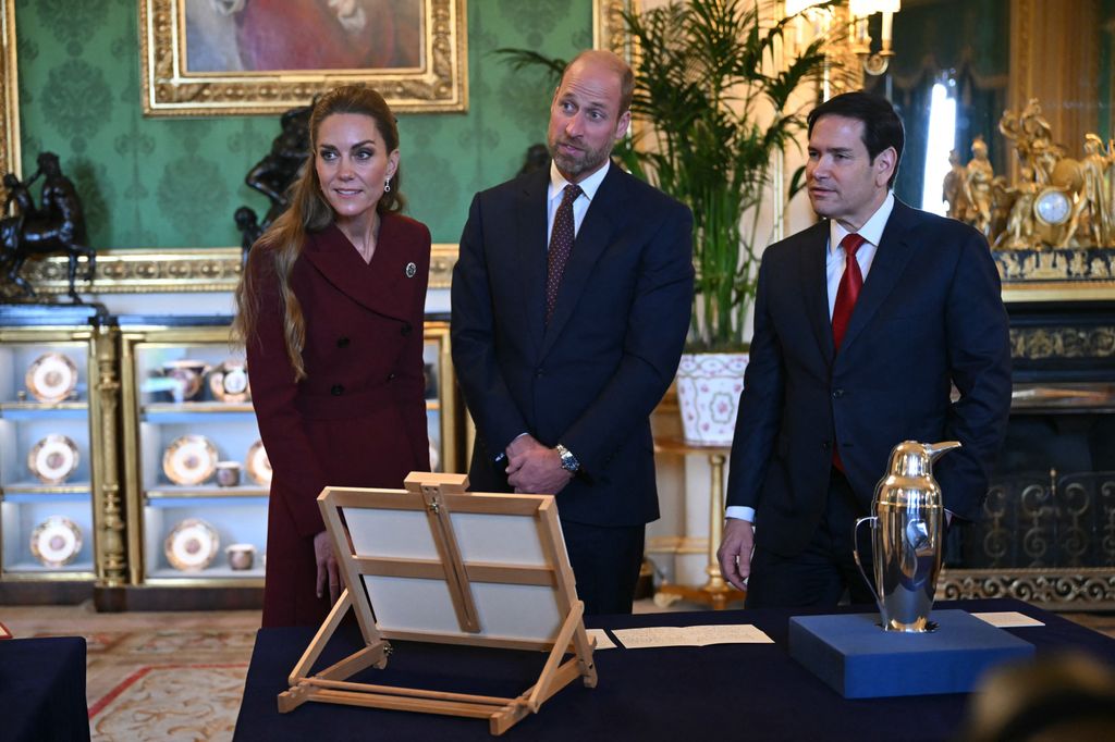 Britain's Catherine, Princess of Wales, Britain's Prince William, Prince of Wales and US Secretary of State Marco Rubio view items from the Royal Collection in the Green Drawing Room at Windsor Castle, in Windsor, on September 17, 2025, during the US President's second State Visit. US President Donald Trump arrived in Britain for an unprecedented second State Visit, with the UK government rolling out a royal red carpet welcome to win over the mercurial leader. (Photo by ANDREW CABALLERO-REYNOLDS / AFP) (Photo by ANDREW CABALLERO-REYNOLDS/AFP via Getty Images)