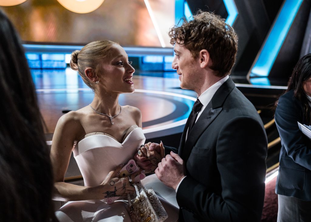 HOLLYWOOD, CALIFORNIA - MARCH 02: (EDITORIAL ONLY, NO BOOK COVERS) (L-R) Ariana Grande and Ethan Slater attend the 97th Annual Oscars at Dolby Theatre on March 02, 2025 in Hollywood, California. (Photo by John Shearer/97th Oscars/The Academy via Getty Images)