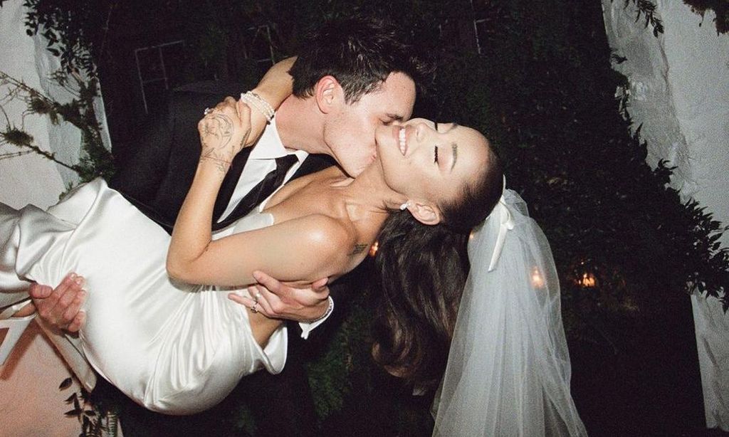 Ariana Grande and Dalton Gomez kiss at their wedding