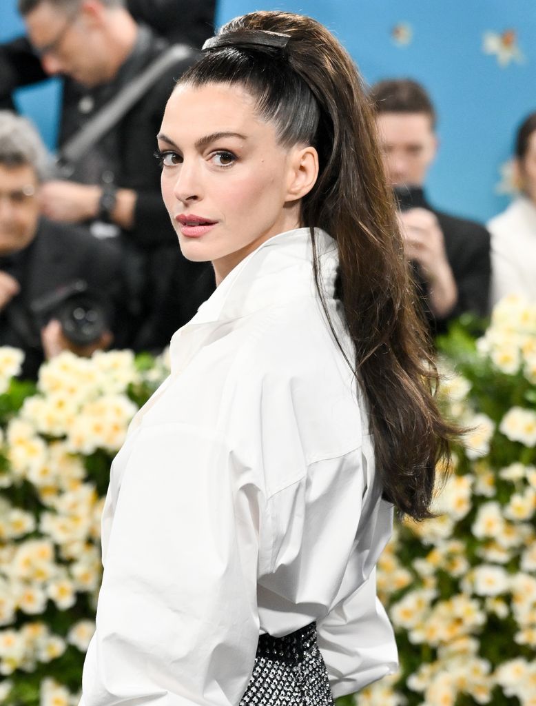Anne Hathaway attends the 2025 Met Gala Celebrating "Superfine: Tailoring Black Style" at Metropolitan Museum of Art on May 05, 2025 in New York City