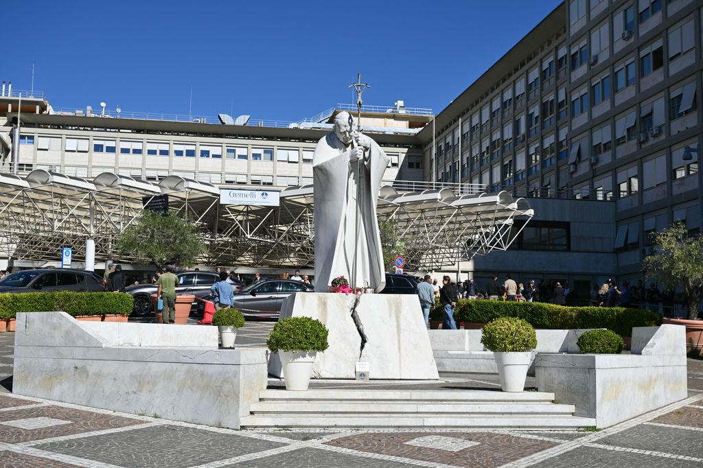 A general view shows the statue of pope John Paul II at the Gemelli University Hospital in Rome where Pope Leo XIV has been admitted ahead of an operation to remove a lump from his lung on October 13, 2026. (Photo by Alberto PIZZOLI / AFP via Getty Images)