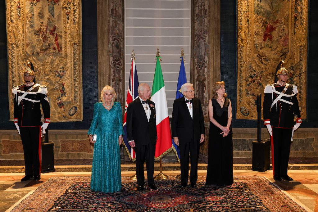 Italy's President Sergio Mattarella and the President's daughter, Laura Mattarella (R) welcome Britain's King Charles III and Queen Camilla at the Quirinale Presidential Palace for a state banquet, on April 9, 2025.  (Photo by Andrew PARSONS / POOL / AFP) (Photo by ANDREW PARSONS/POOL/AFP via Getty Images)     
