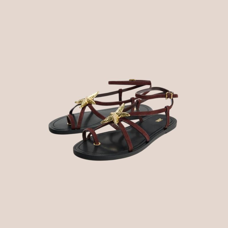 sandalias planas con estrella dorada