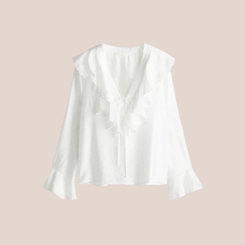 blusa blanca con volantes