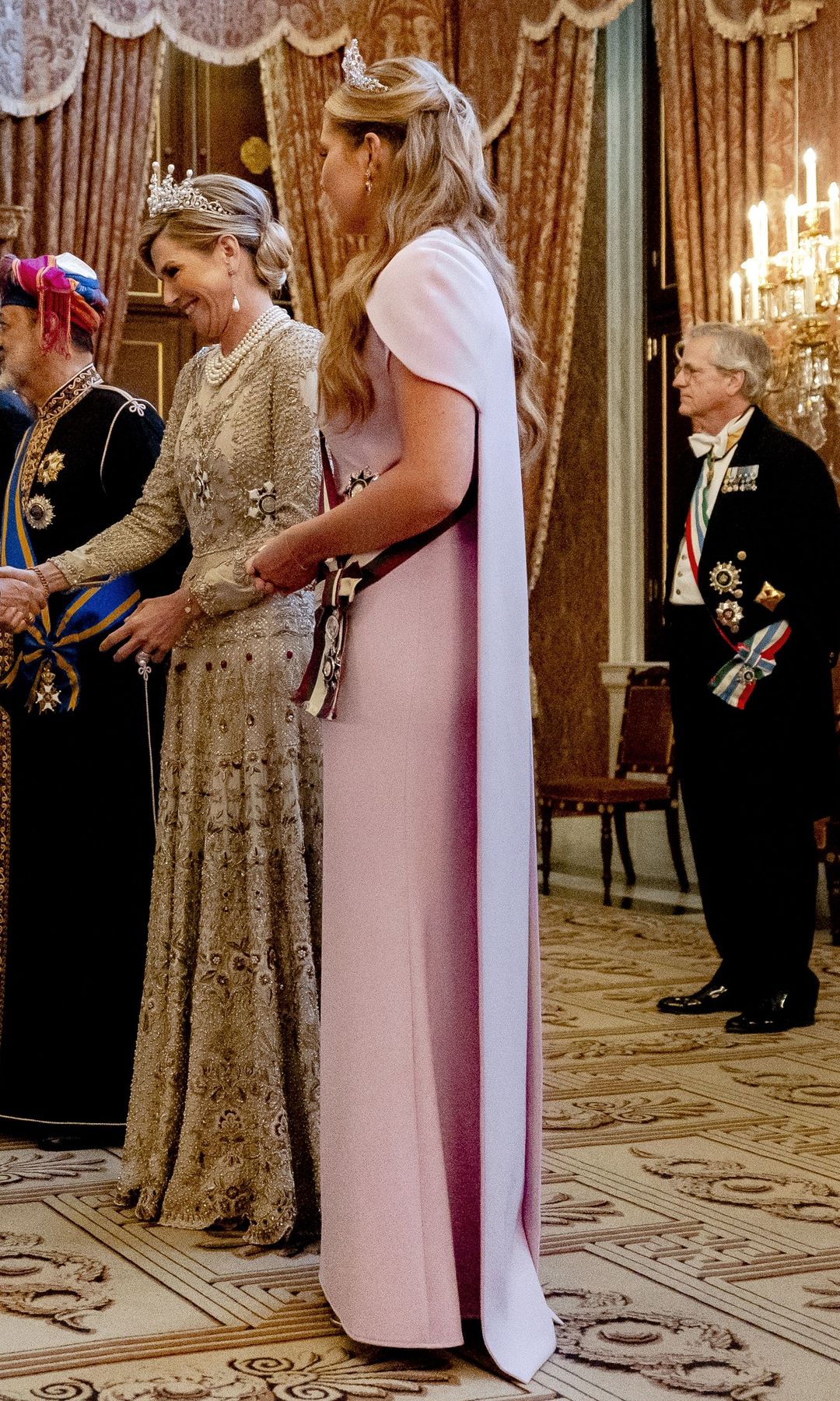 King Willem-Alexander, Queen Maxima, Princess Amalia and Sultan Haitham bin Tarik with Marjolein Faber, Minister of Asylum and Migration, during the passade, prior to the state banquet at the Royal Palace