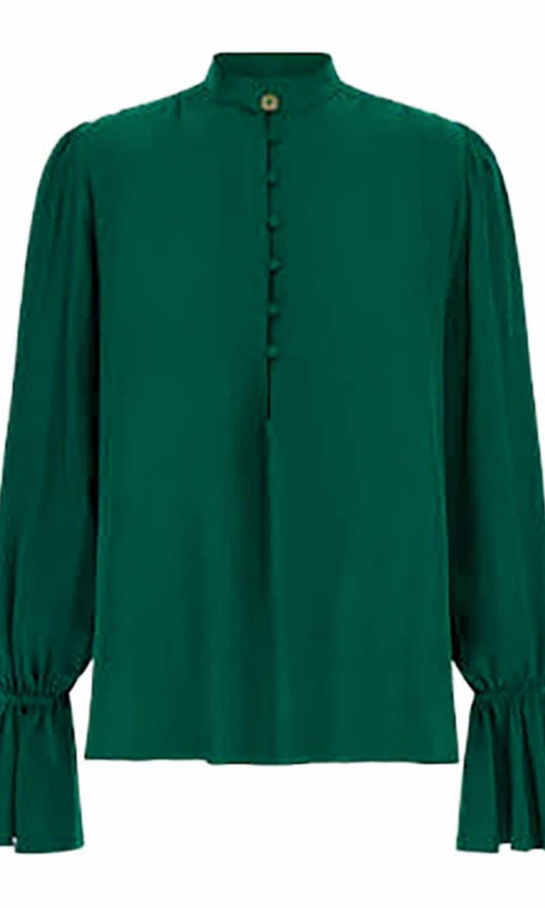 Blusa
con fruncidos (650 €), 
de Roberto Cavalli.