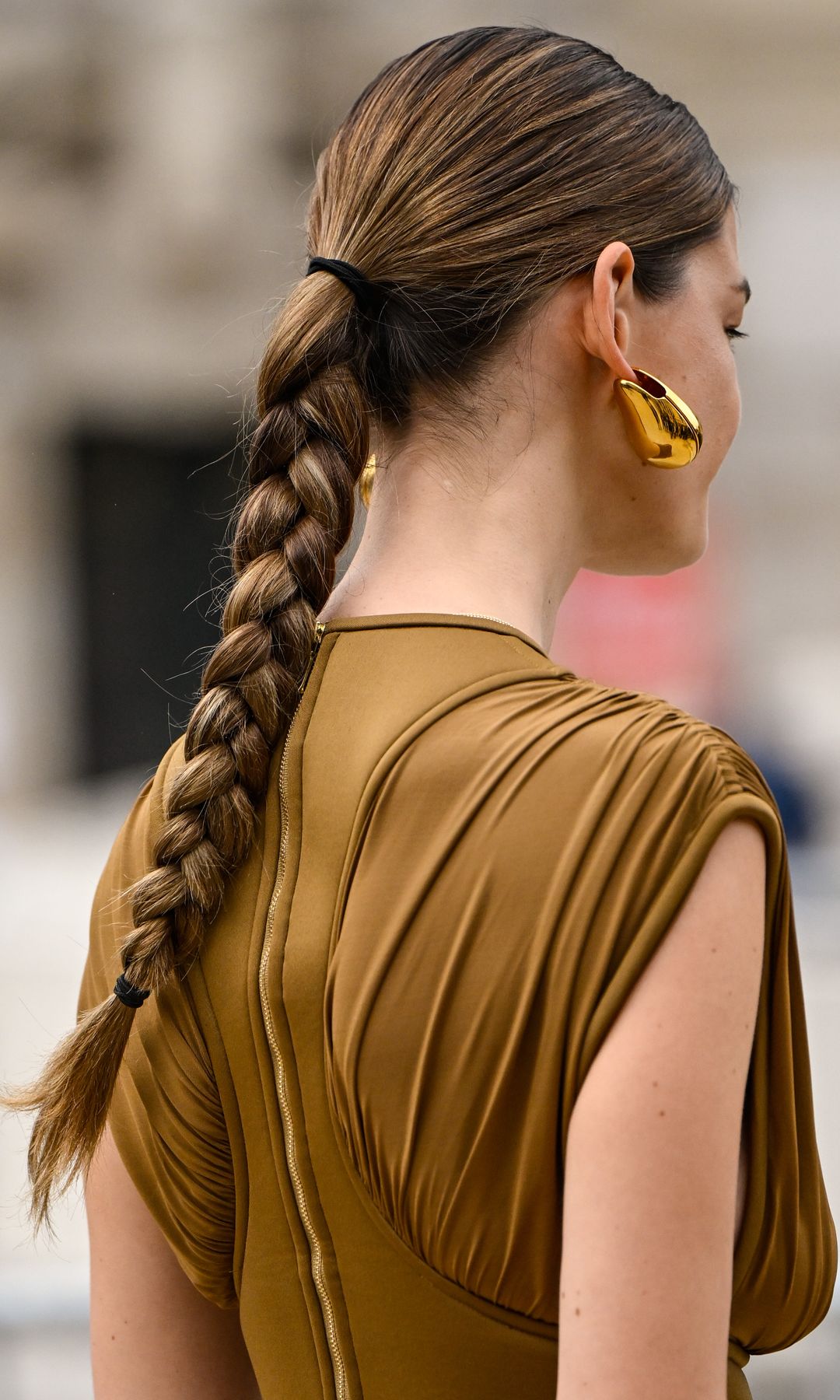 PARIS, FRANCE - MARCH 10: Model Ophelie Guillermand is seen wearing a brown Zimmermann sleeveless top and brown Zimmermann pants with gold jewelry outside the Zimmermann show during the Womenswear Fall/Winter 2025/2026 as part of Paris Fashion Week on March 10, 2025 in Paris, France. (Photo by Daniel Zuchnik/Getty Images)