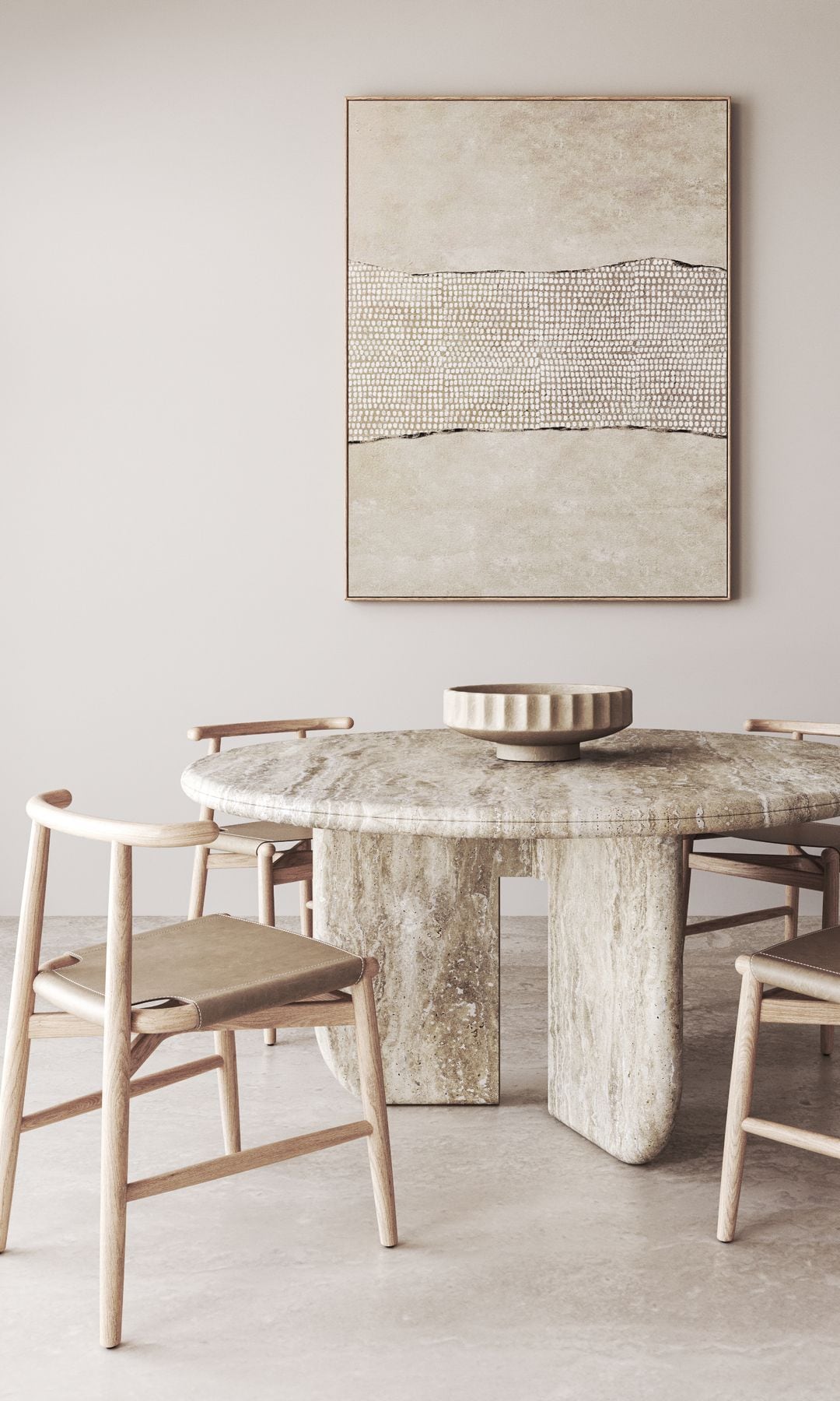 Comedor decorado en tonos neutros y luminosos con mesa de piedra