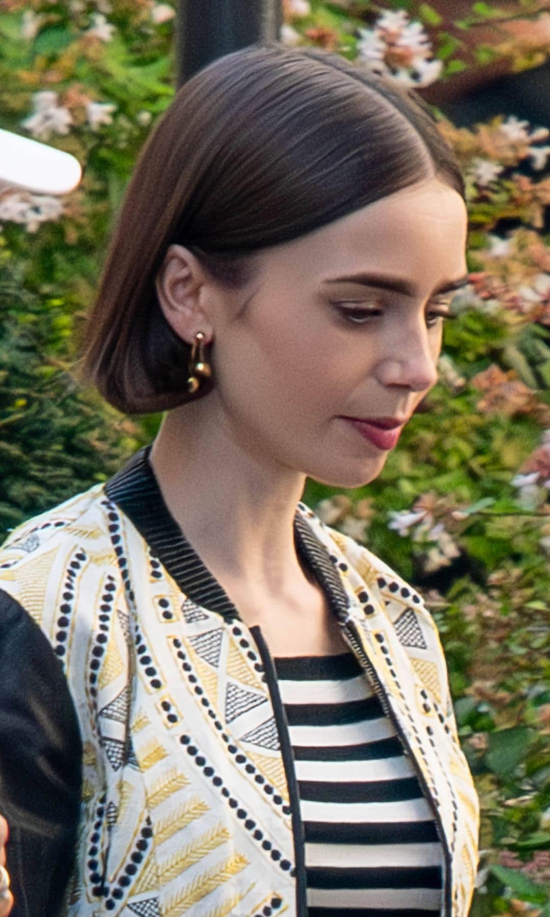 Actress Lily Collins is seen on the set of Emily in Paris Season V on August 4, 2025 in Paris, France