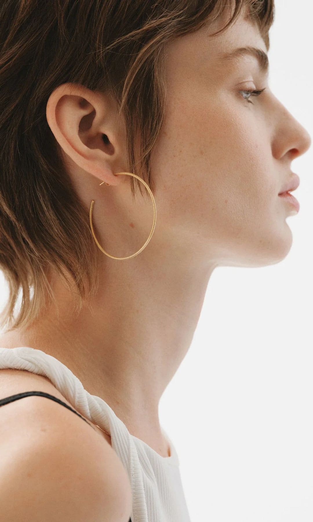 Pendientes de aro de plata bañada en oro amarillo de 18K, de Aristocrazy (99 eutos)