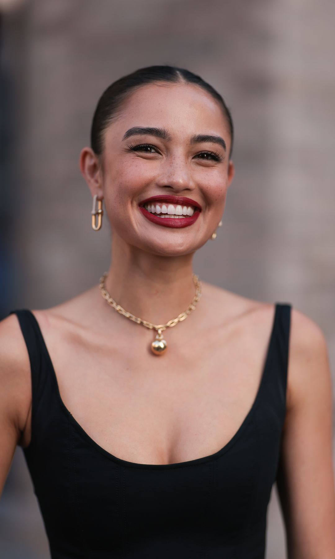 NEW YORK - SEPTEMBER 12: Sara Sampaio is seen wearing yellow-gold earrings a necklace from Tiffany & Co., HardWear Collection and a sleeveless, round-necked, black midi dress before the Carolina Herrera Spring Summer 2024 Runway Show on September 12, 2023 in New York City