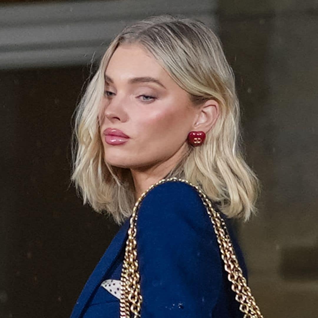 PARIS, FRANCE - JANUARY 29: Elsa Hosk wears dark blue blazer jacket, white black pattern bag, navy blue washed denim jean pants, white sneaker shoes, outside Valentino, during the Haute Couture Spring/Summer 2025 on January 29, 2025 in Paris, France. (Photo by Edward Berthelot/Getty Images)