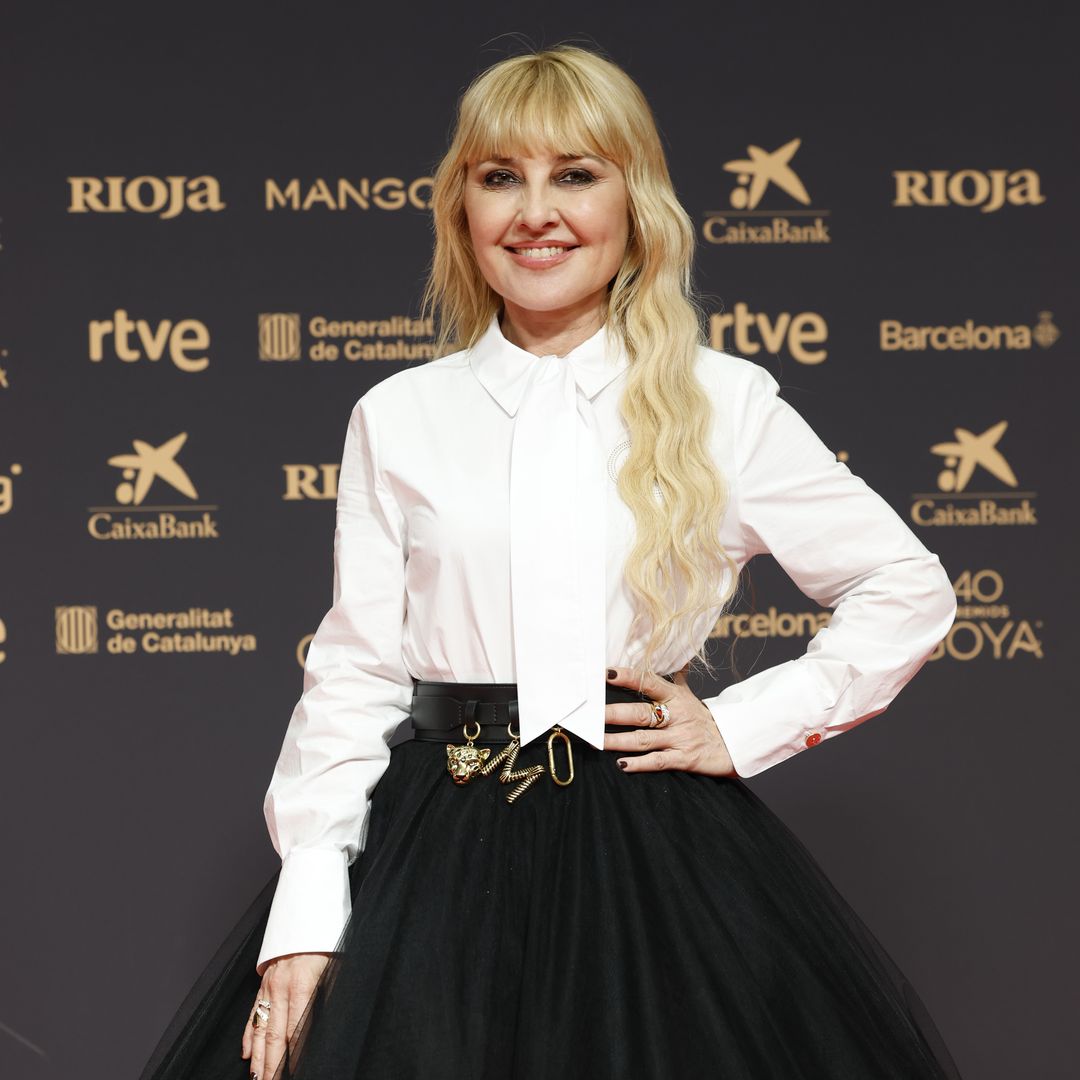 Cayetana Guillén Cuervo posing in a white blouse and black skirt during the Goya Awards 2026 in Barcelona, Spain, on Saturday, 28 February 2026.