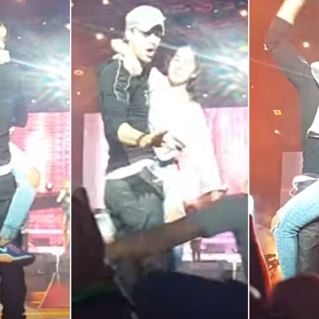La reacción de Enrique Iglesias cuando una fan salta al escenario, le abraza... ¡y se niega a soltarle!