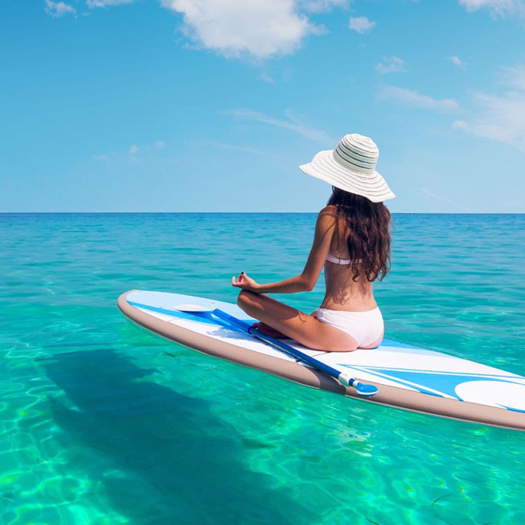 Paddle surf: el deporte que te ayudará a adelgazar y a tonificar este verano