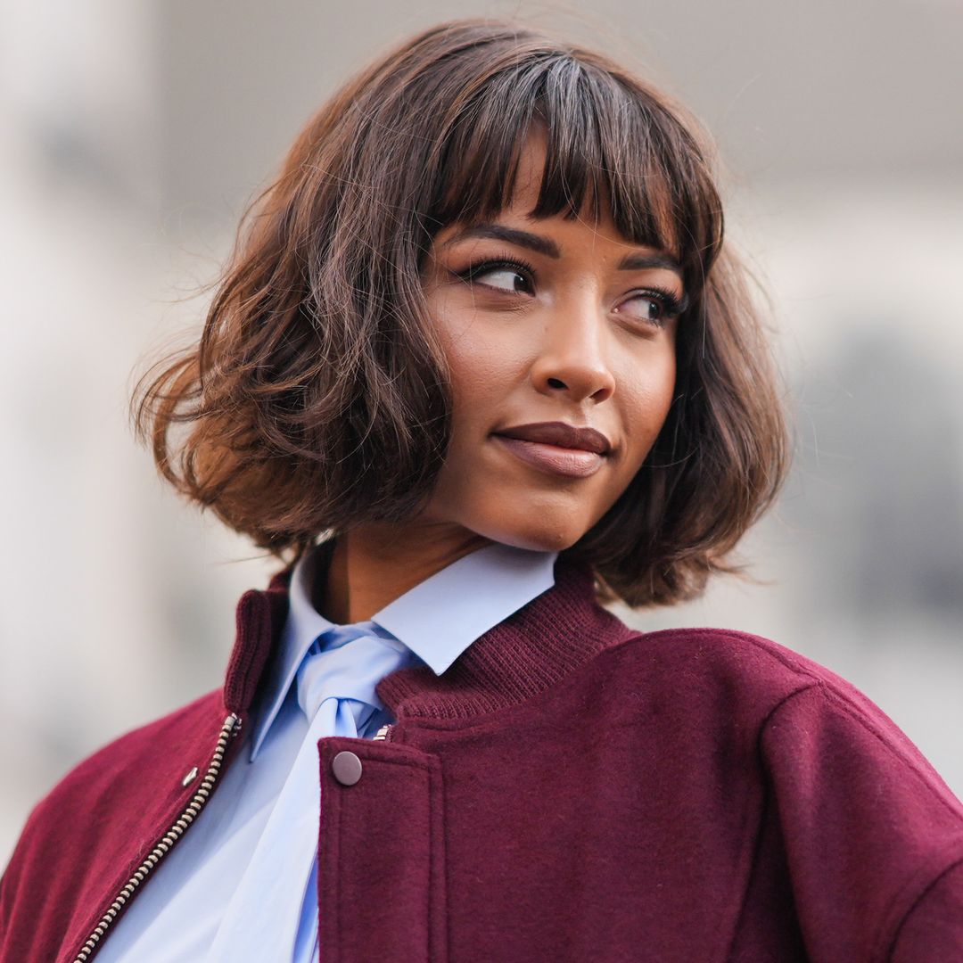 PARIS, FRANCE - FEBRUARY 28: Flora Coquerel wears a burgundy oversized bomber jacket , a pastel pale blue long shirt / midi dress with a tie, outside Casablanca, during the Womenswear Fall/Winter 2024/2025 as part of Paris Fashion Week on February 28, 2024 in Paris, France. (Photo by Edward Berthelot/Getty Images)