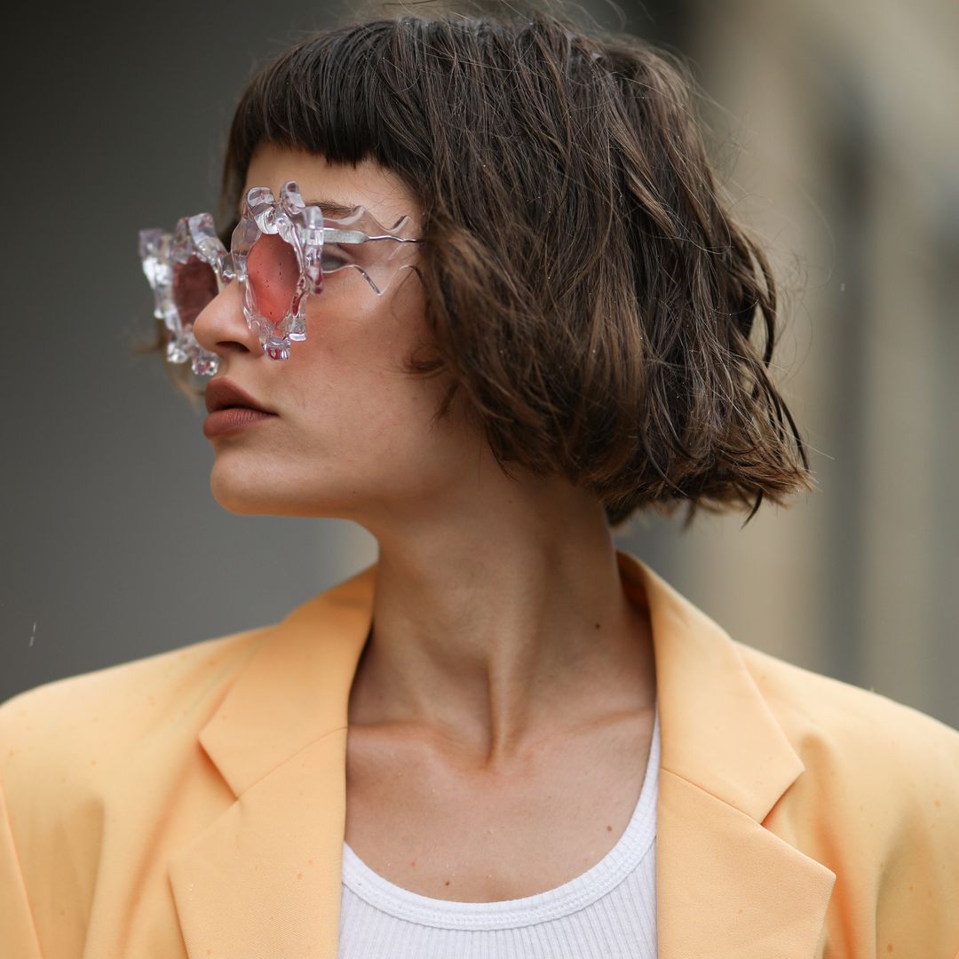 BERLIN, GERMANY - JULY 15: Lea Neumann wearing Komono shades, vintage orange blazer and Urban Outfitters top on July 15, 2020 in Berlin, Germany. (Photo by Jeremy Moeller/Getty Images)