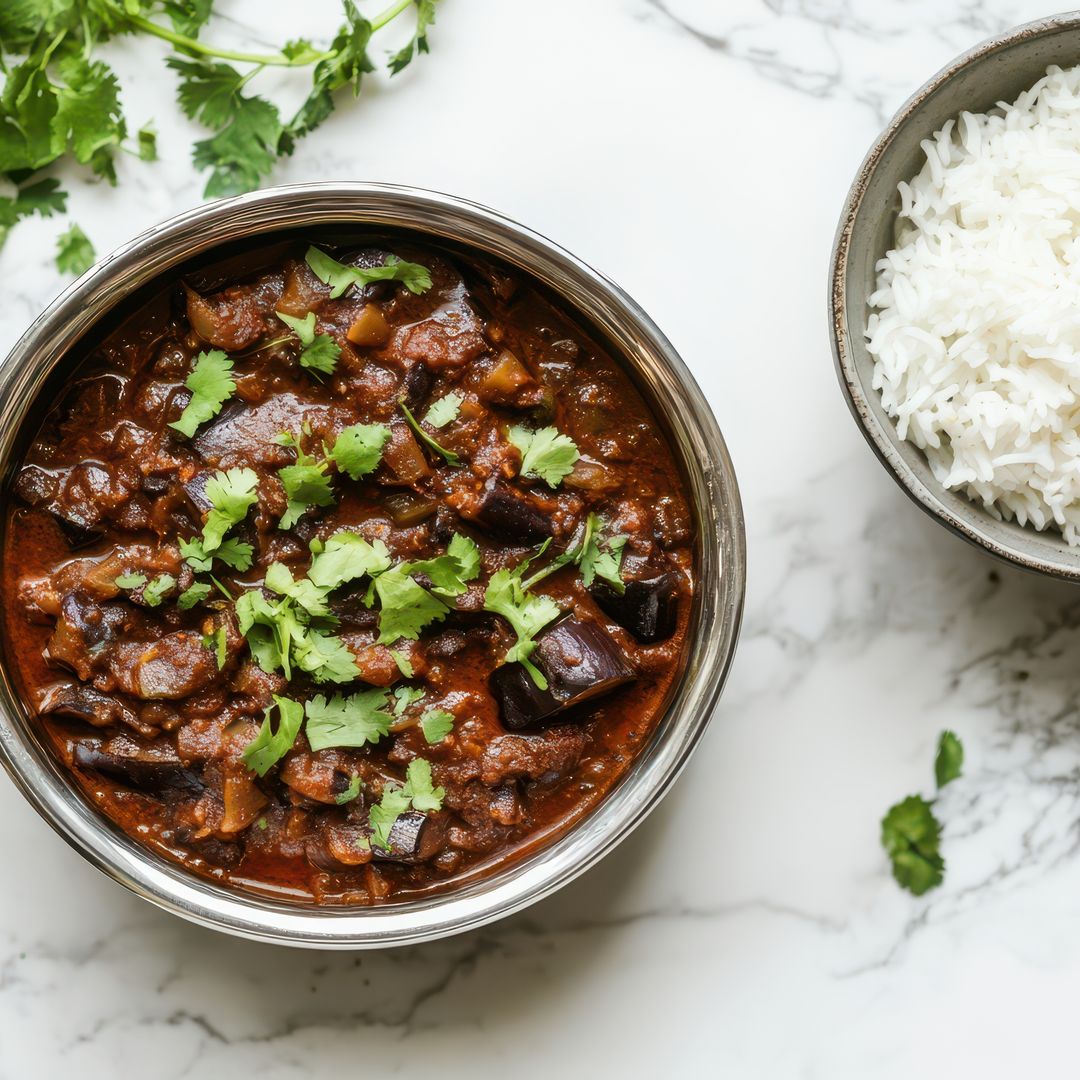 Curry de berenjena y leche de coco con arroz basmati