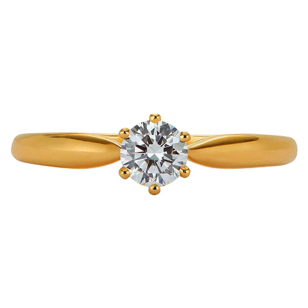 Anillo en oro amarillo con diamante (1.570 €), de Suarez