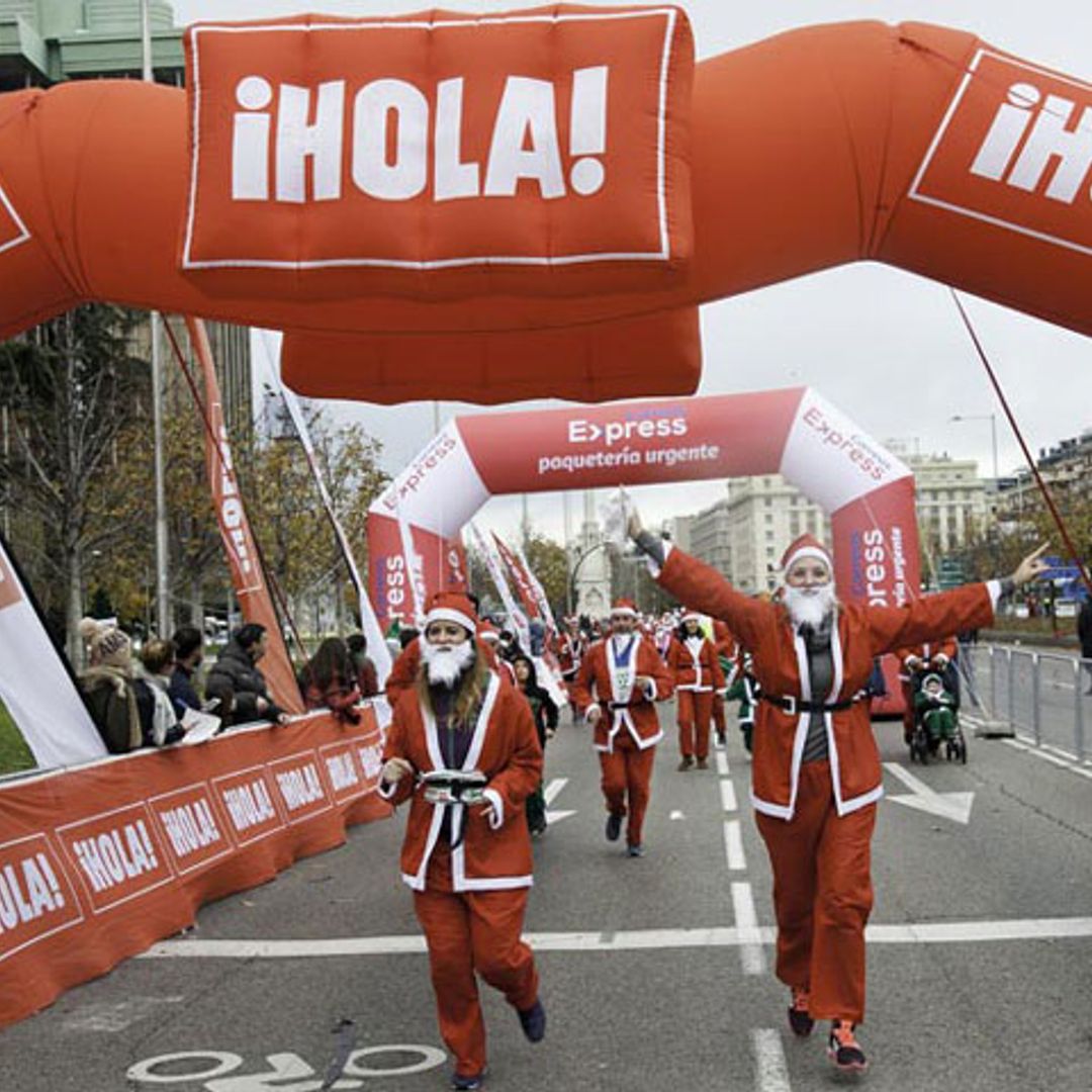 10.000 'Papás Noel' han conquistado Madrid en su carrera más navideña