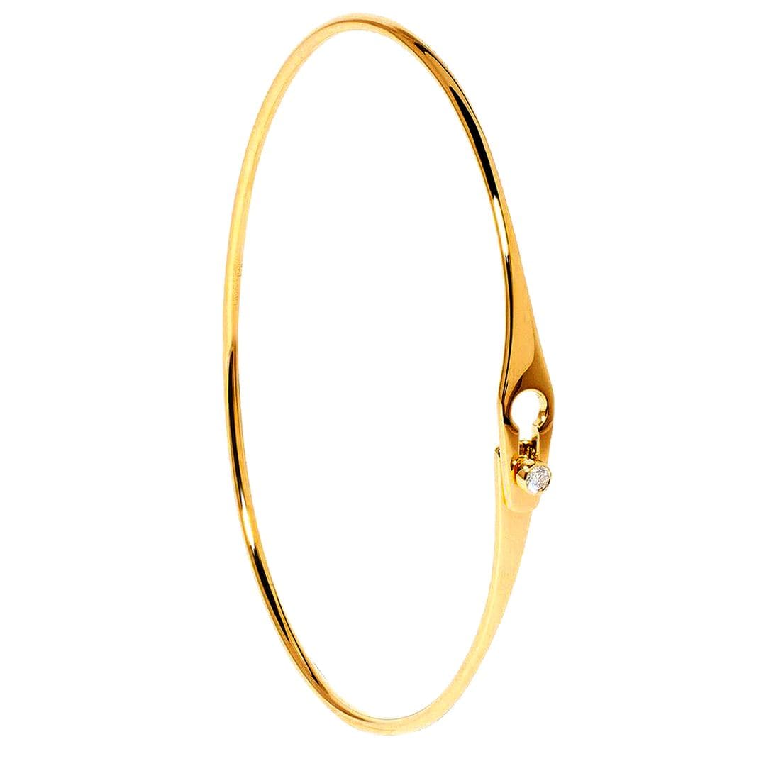 Pulsera de oro amarillo y diamante (2.860 €), de Dinh Van