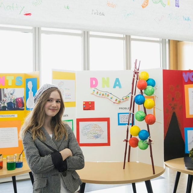 portrait of school girl at science fair