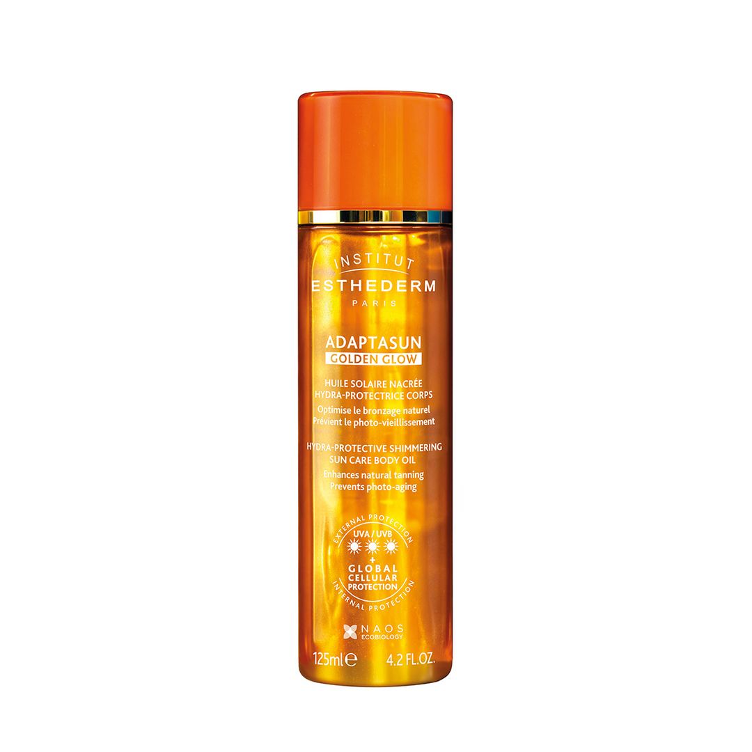 Aceite Corporal Adaptasun Golden Glow, de Institut Estherderm (53,90 euros), enriquecido con la tecnología Global Cellular Protection que previene el fotoenvejecimiento y refuerza las defensas naturales de la piel frente al sol mientras protege el ADN celular y combate la degradación del colágeno.  