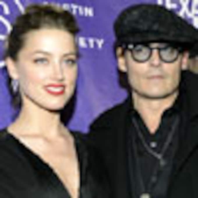 Johnny Depp 'tendría cien hijos más' con su prometida, Amber Heard