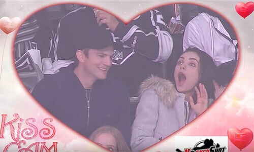 Ashton Kutcher goes in for a passionate Kiss Cam smooch – watch Mila Kunis' hilarious reaction!