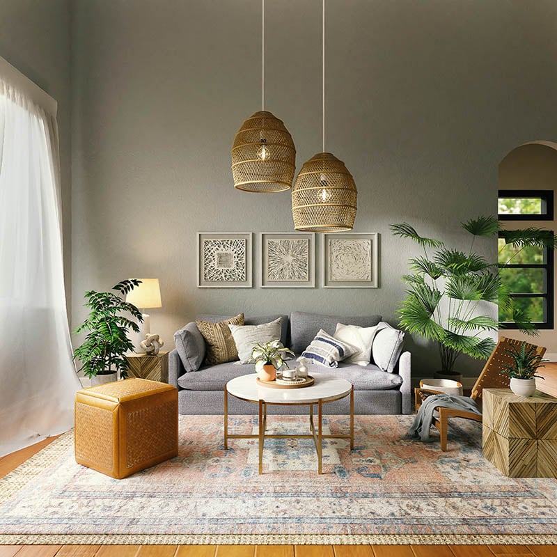 Salón con las paredes pintadas de color gris sofá gris y puff y lámpara de fibras naturales.