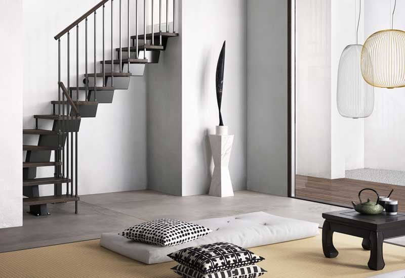 Salón zen con escalera negra