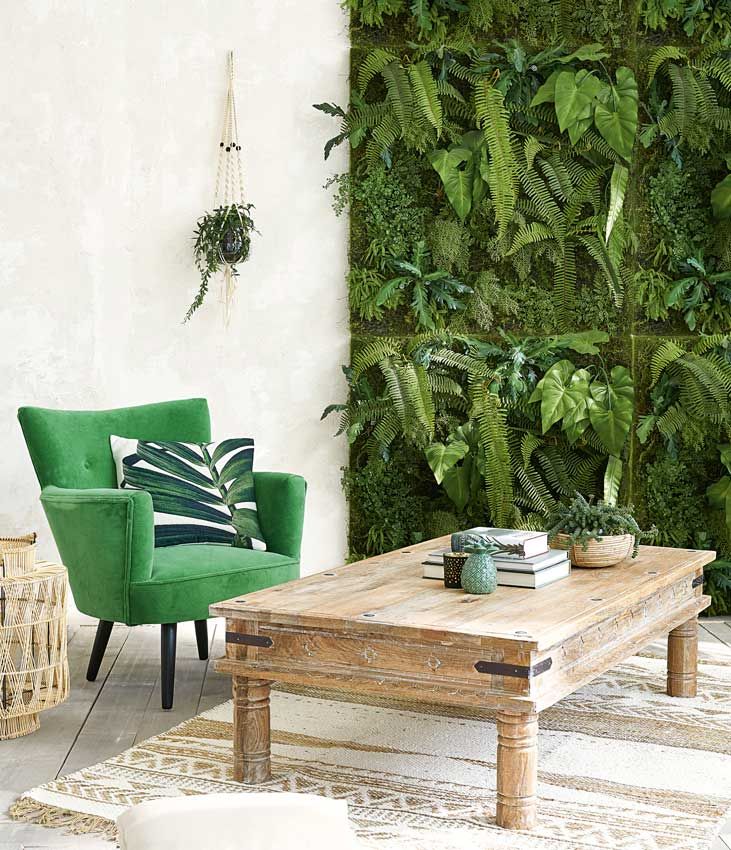 Espacio de estar garden room con jardín vertical