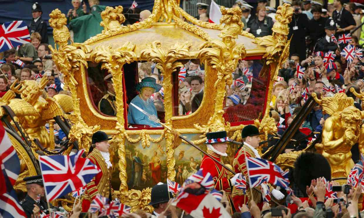  Britain's Queen Elizabeth and Prince Philip ride in the Golden State Carriage