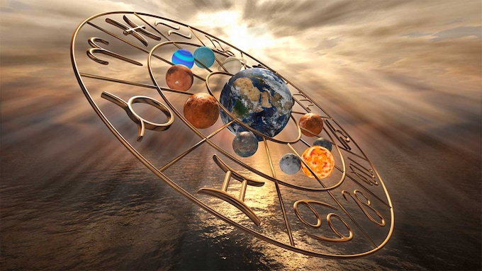 Representación espiritual de los signos del zodiaco con la Tierra en el centro flotando sobre el océano