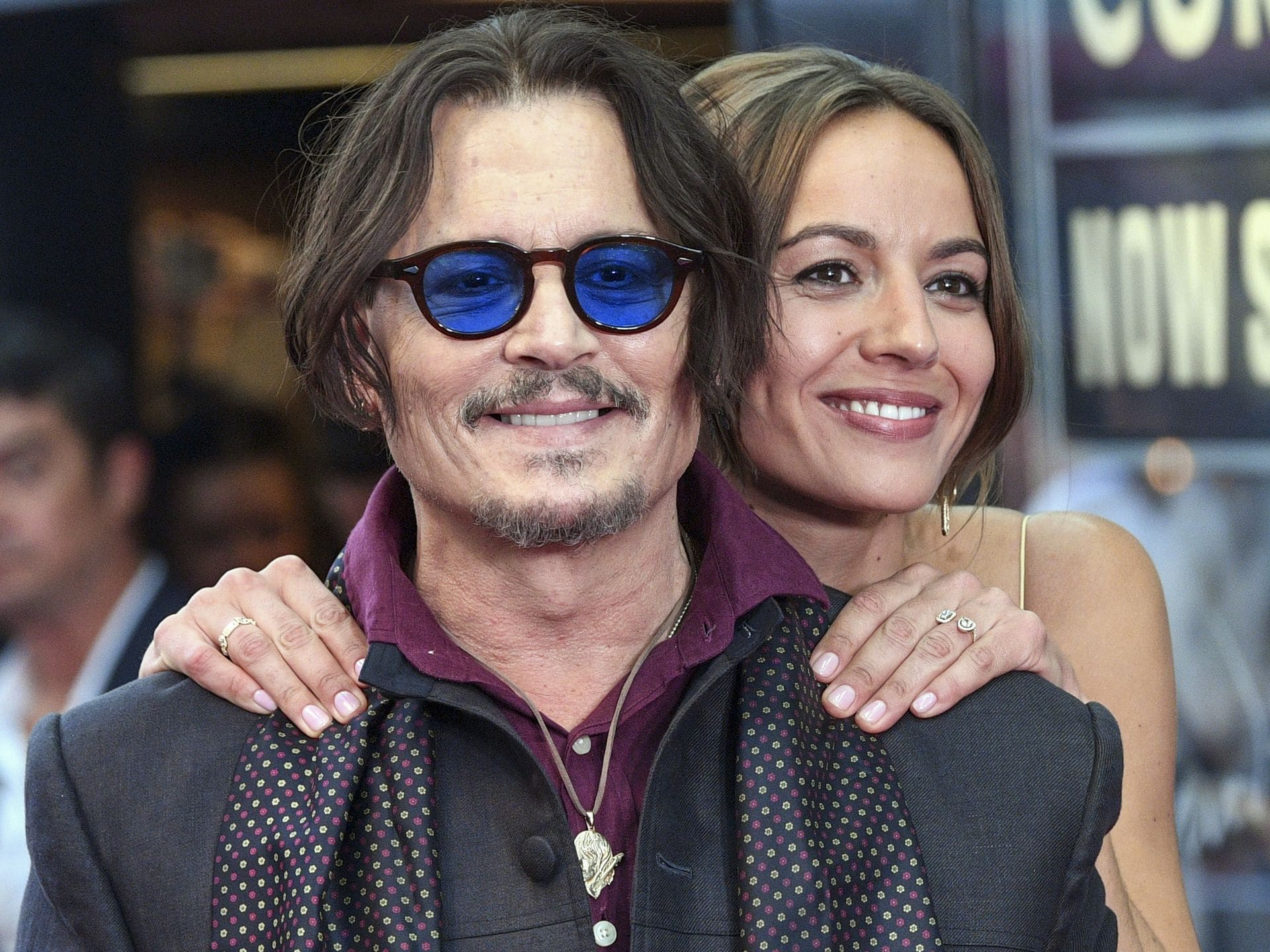 Johnny Depp kisses Antonia Desplat at the premiere of his new movie