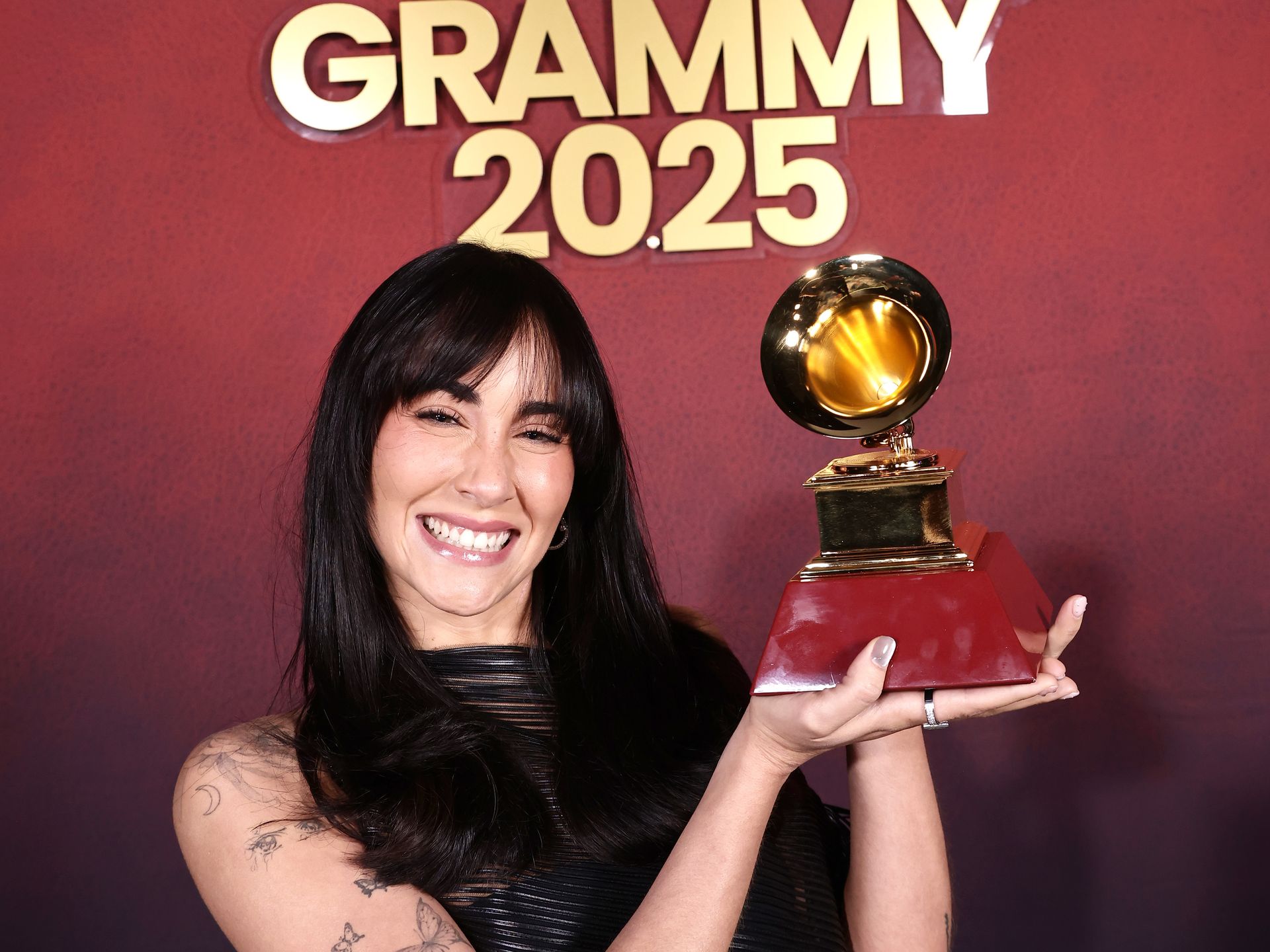 Aitana wins her first Latin GRAMMY in a semi-sheer gothic mini-dress