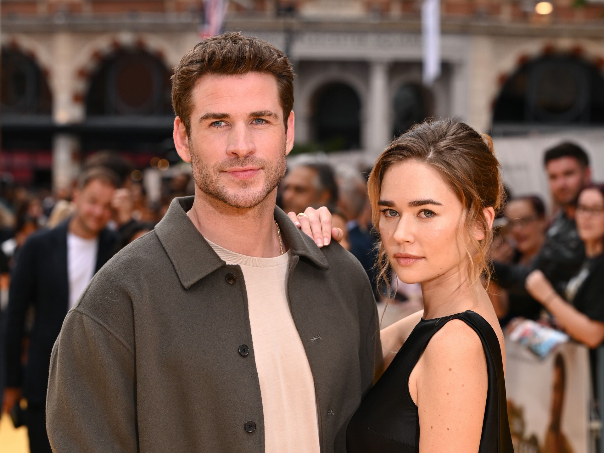liam.hemsworth girlfriend gold dress Liam Hemsworth and Gabriella Brooks Make Their Red Carpet Debut