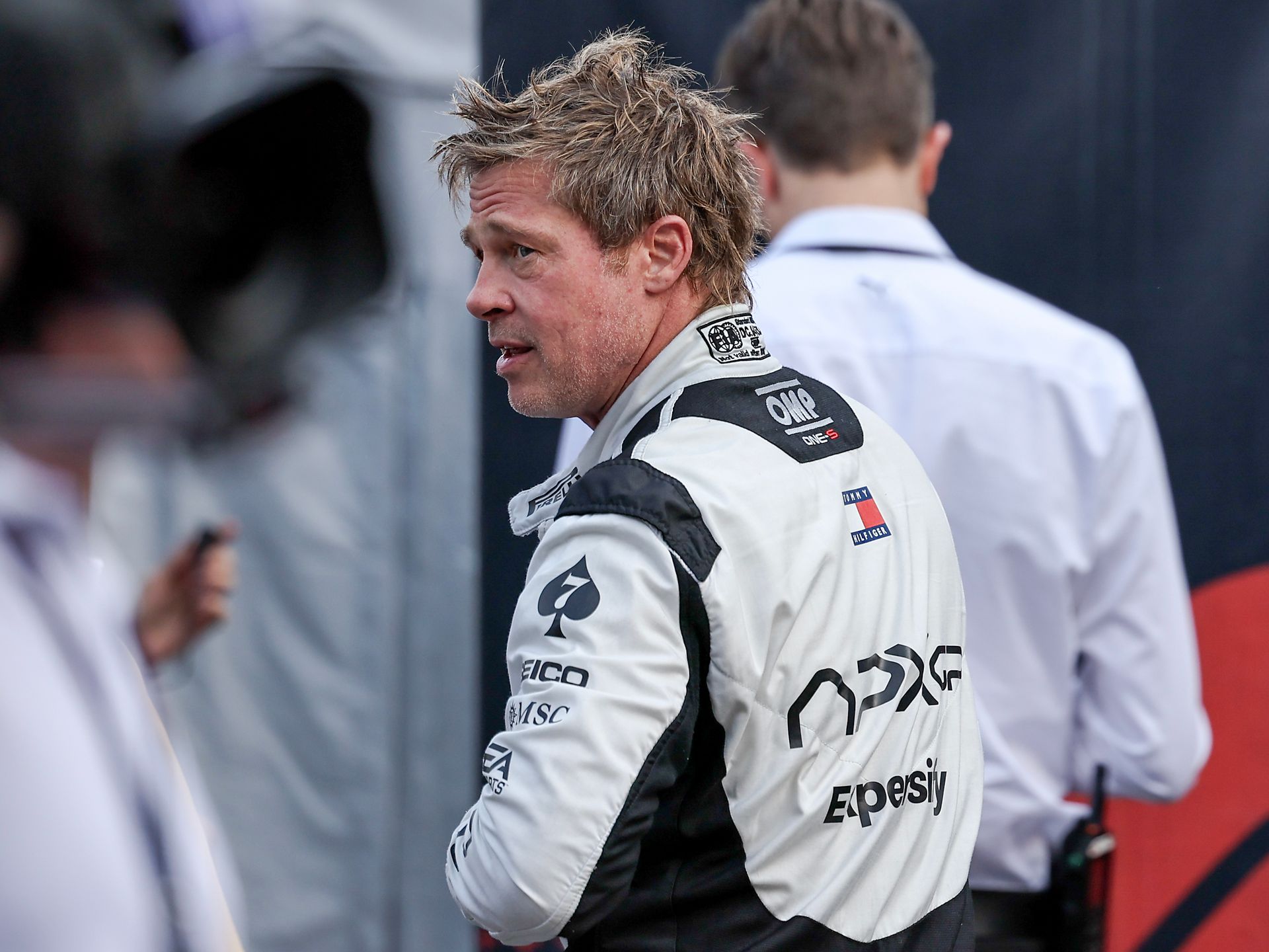 Brad Pitt's fan sparked an online debate after holding the actor's neck to  kiss him [VIDEO]