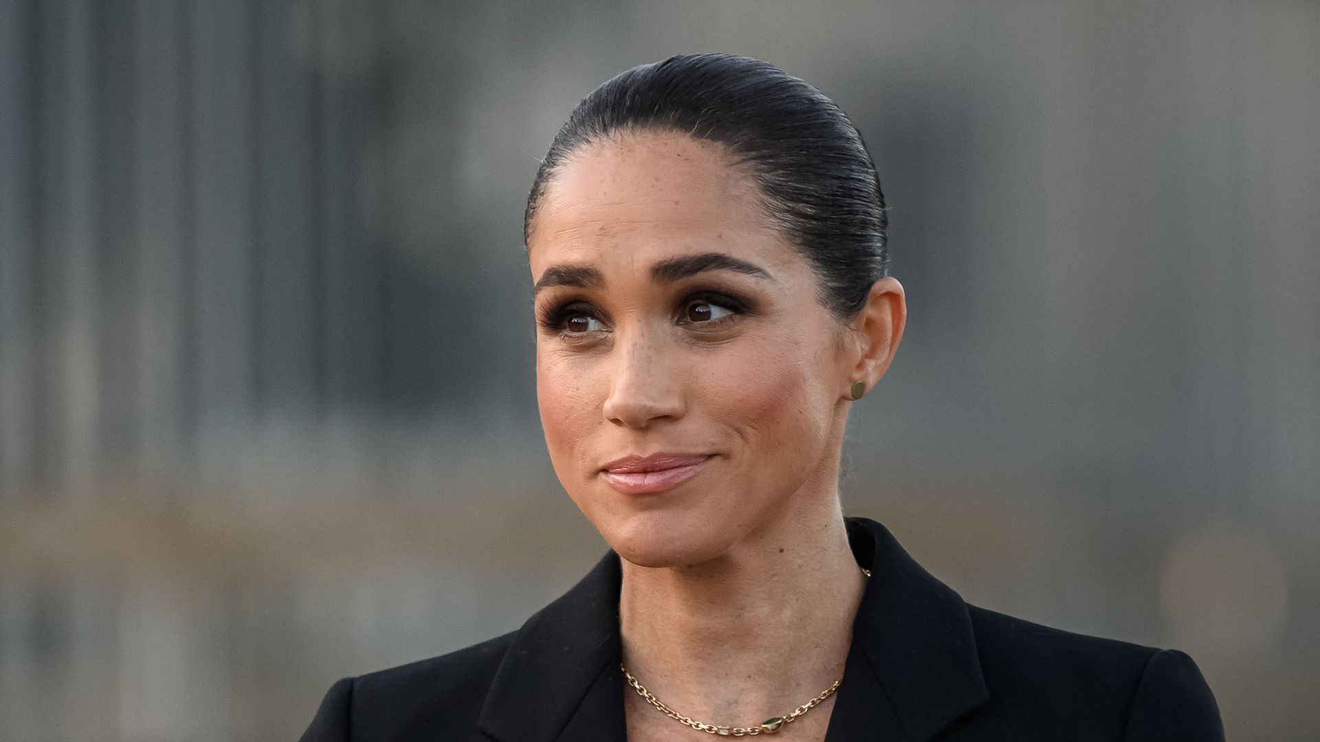 Britain's Meghan, the Duchess of Sussex delivers a speech at the opening of the "Lost Screen Memorial", an art installation of giant illuminated smartphones representing 50 children who tragically lost their lives following harm linked to social media, displayed at Place des Nations, ahead of the 79th World Health Assembly in Geneva, on May 17, 2026. (Photo by Fabrice COFFRINI / AFP via Getty Images)