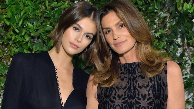 Kaia Gerber in black and Cindy Crawford in an embroidered dress